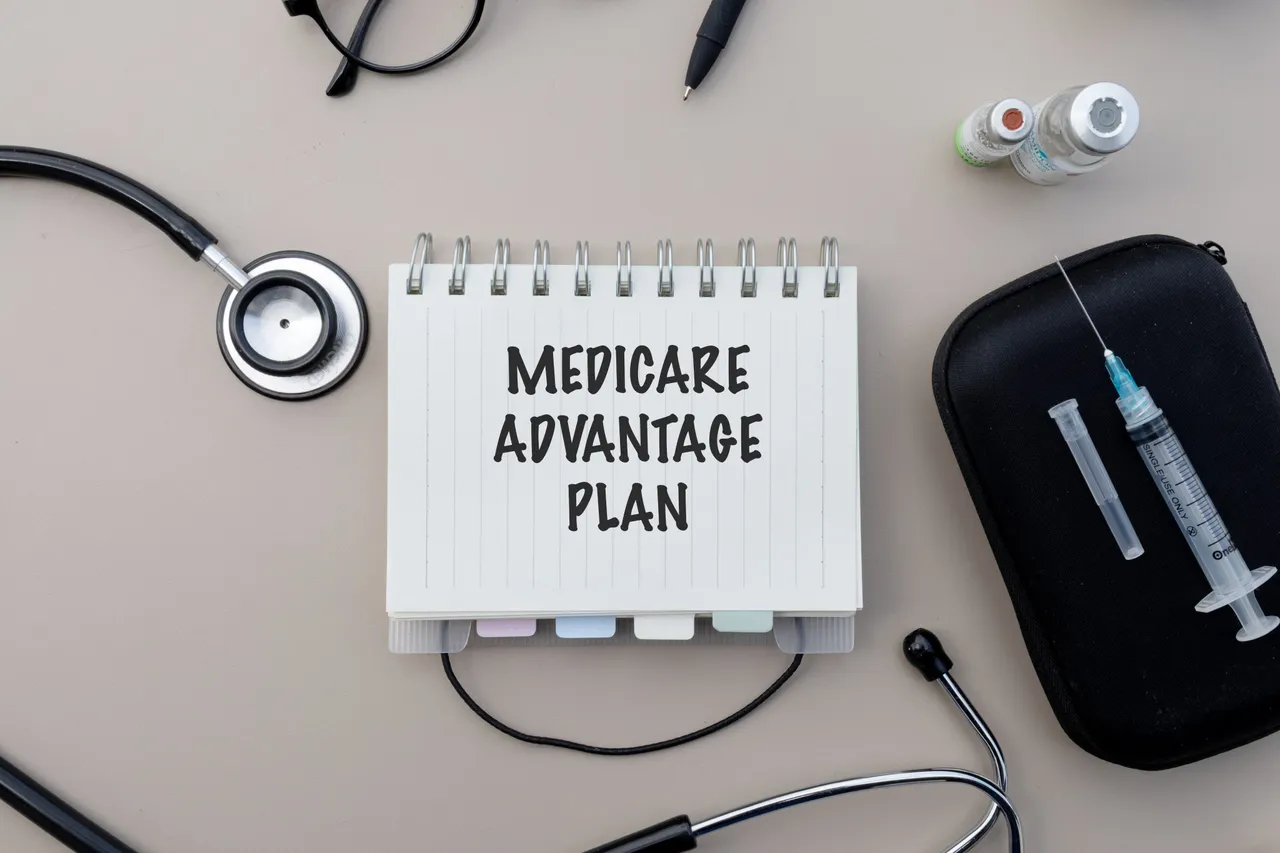 Medicare Advantage plan notes written on a notepad beside a pen and healthcare documents